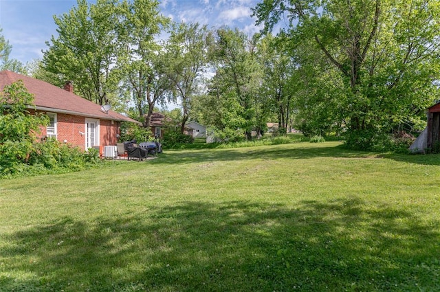 300 N Alvarado Ave, Belle, MO 65013 - view of grassy yard featuring central AC unit