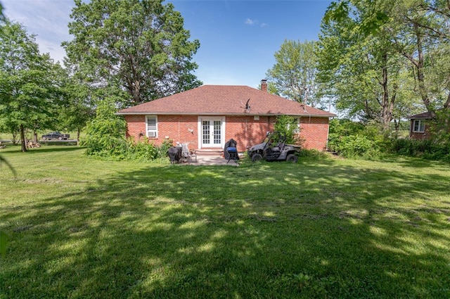 300 N Alvarado Ave, Belle, MO 65013 - back of property featuring a yard, french doors, a chimney, and a patio