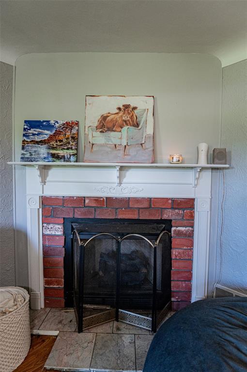300 N Alvarado Ave, Belle, MO 65013 - detailed view of a fireplace and a textured wall