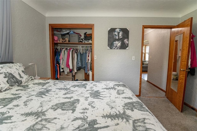 300 N Alvarado Ave, Belle, MO 65013 - bedroom with a textured wall, carpet floors, a closet, and baseboards