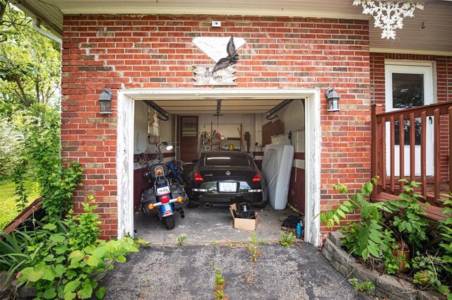 300 N Alvarado Ave, Belle, MO 65013 - garage featuring asphalt driveway