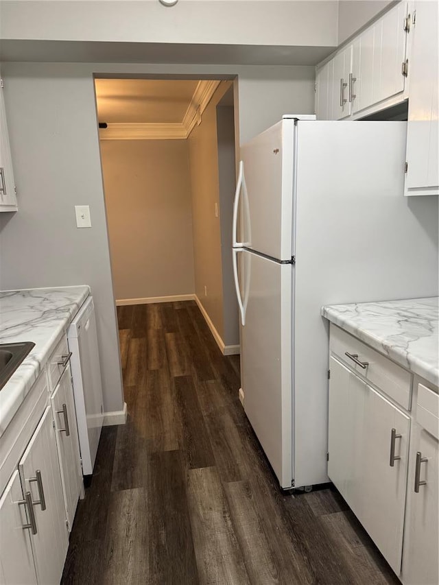 635 Rosetta Dr Unit D, Florissant, MO 63031 - kitchen featuring dark wood-style floors, dishwashing machine, white cabinets, freestanding refrigerator, and crown molding