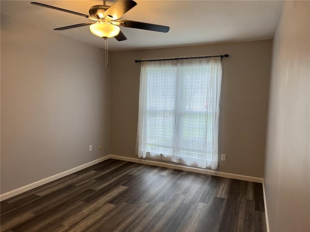 635 Rosetta Dr Unit D, Florissant, MO 63031 - empty room featuring plenty of natural light, ceiling fan, dark wood finished floors, and baseboards