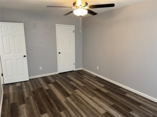 635 Rosetta Dr Unit D, Florissant, MO 63031 - unfurnished bedroom with dark wood-type flooring, baseboards, and ceiling fan