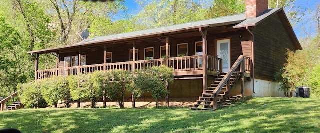 765 Carter 103, Van Buren, MO 63965 - view of front of house with stairway, a chimney, a front lawn, and a deck