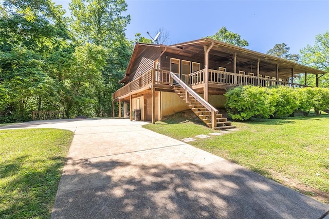 765 Carter 103, Van Buren, MO 63965 - view of front facade with a front lawn, concrete driveway, and stairs