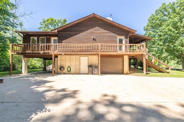 765 Carter 103, Van Buren, MO 63965 - rustic home with driveway, an attached garage, stairway, a carport, and a wooden deck