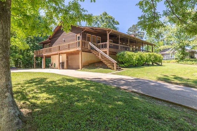 765 Carter 103, Van Buren, MO 63965 - view of front facade featuring a front yard, concrete driveway, stairs, and a wooden deck