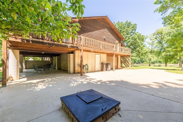 765 Carter 103, Van Buren, MO 63965 - back of house featuring stairway, a deck, and a patio area