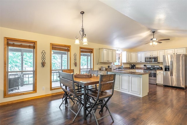 765 Carter 103, Van Buren, MO 63965 - dining room featuring lofted ceiling, dark wood-style flooring, a ceiling fan, and baseboards