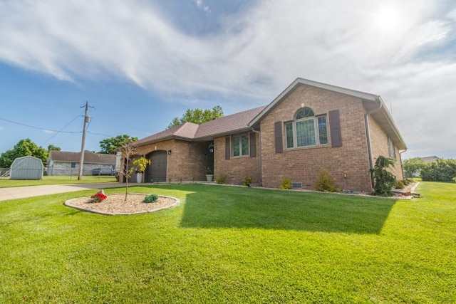 2115 Tower Rd, Lebanon, MO 65536 - ranch-style home with concrete driveway, brick siding, a garage, and a front yard