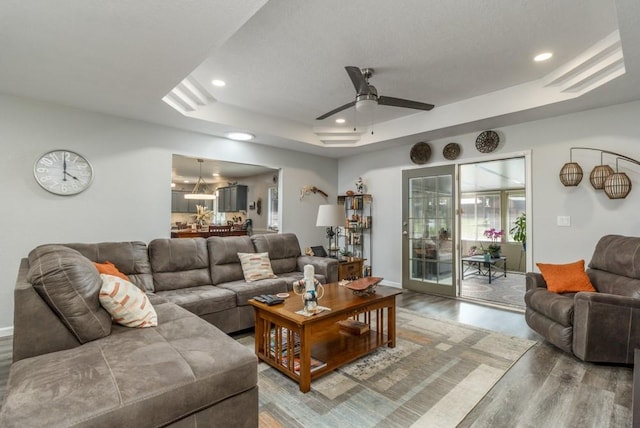 2115 Tower Rd, Lebanon, MO 65536 - living area featuring wood finished floors, a raised ceiling, recessed lighting, and a ceiling fan