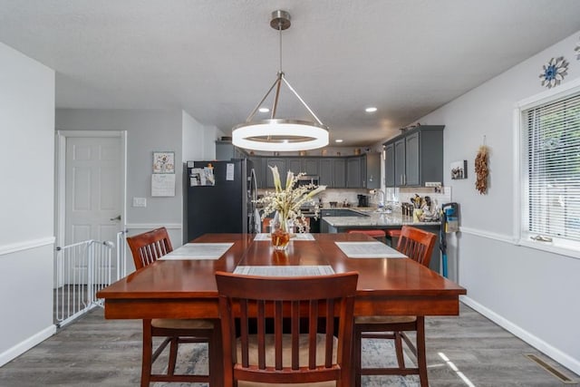 2115 Tower Rd, Lebanon, MO 65536 - dining space with wood finished floors, baseboards, and recessed lighting