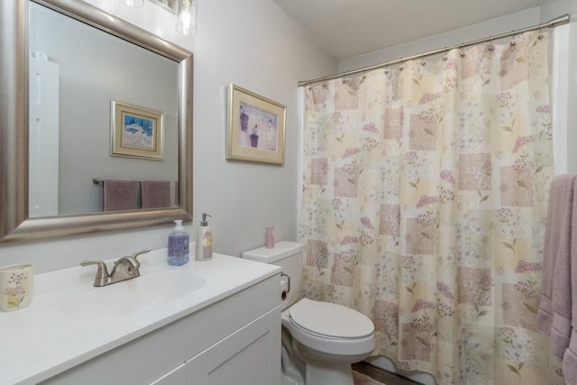 2115 Tower Rd, Lebanon, MO 65536 - bathroom with toilet, vanity, and a shower with shower curtain