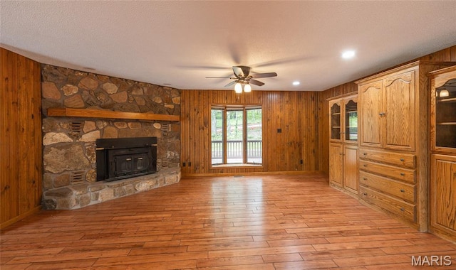 13399 S US Highway 63, Rolla, MO 65401 - unfurnished living room featuring ceiling fan, light wood finished floors, wood walls, recessed lighting, and baseboards
