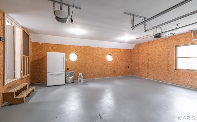 13399 S US Highway 63, Rolla, MO 65401 - garage with freestanding refrigerator and a garage door opener