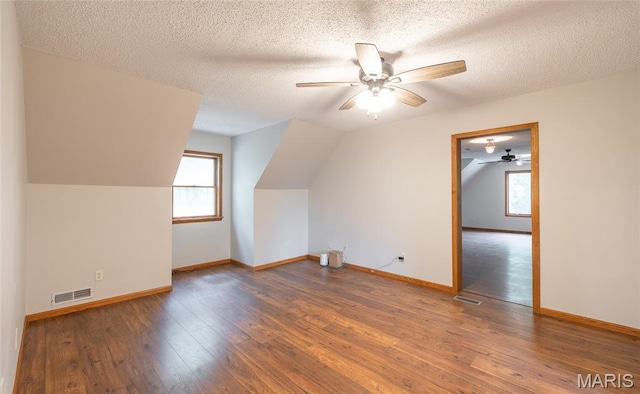 13399 S US Highway 63, Rolla, MO 65401 - bonus room featuring plenty of natural light, a ceiling fan, vaulted ceiling, hardwood / wood-style floors, and a textured ceiling