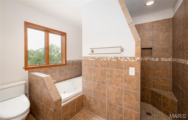 13399 S US Highway 63, Rolla, MO 65401 - bathroom featuring a jetted tub, tiled shower, toilet, and tile walls