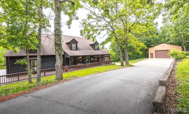 13399 S US Highway 63, Rolla, MO 65401 - view of front of property with an outbuilding, a detached garage, a front yard, and a porch