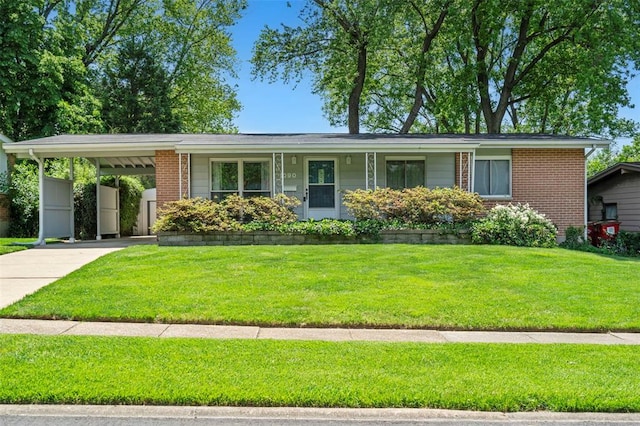 1090 Apache Dr, Florissant, MO 63033 - single story home with concrete driveway, a front lawn, an attached carport, and brick siding