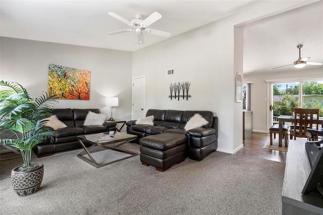 1090 Apache Dr, Florissant, MO 63033 - carpeted living room with ceiling fan, baseboards, and vaulted ceiling