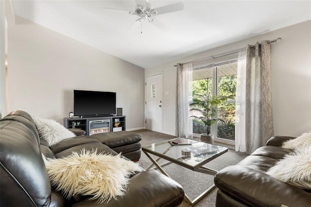 1090 Apache Dr, Florissant, MO 63033 - carpeted living room featuring vaulted ceiling, ceiling fan, and baseboards