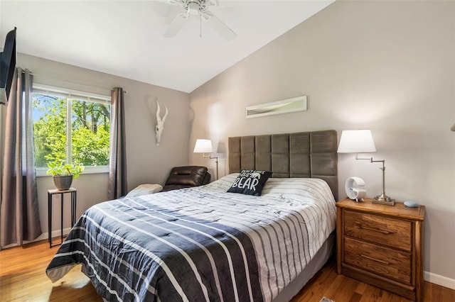 1090 Apache Dr, Florissant, MO 63033 - bedroom with lofted ceiling, wood finished floors, baseboards, and ceiling fan