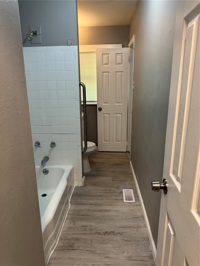 1341 Criterion Ave, Saint Louis, MO 63138 - bathroom featuring toilet, wood finished floors, and baseboards
