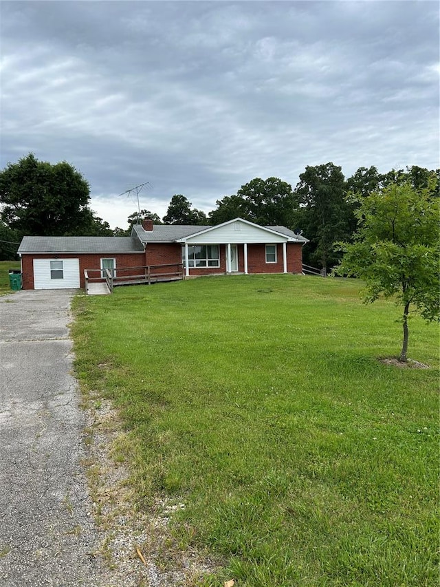 21008 W State Highway 47, Lonedell, MO 63060 - single story home featuring a front yard, driveway, and a garage