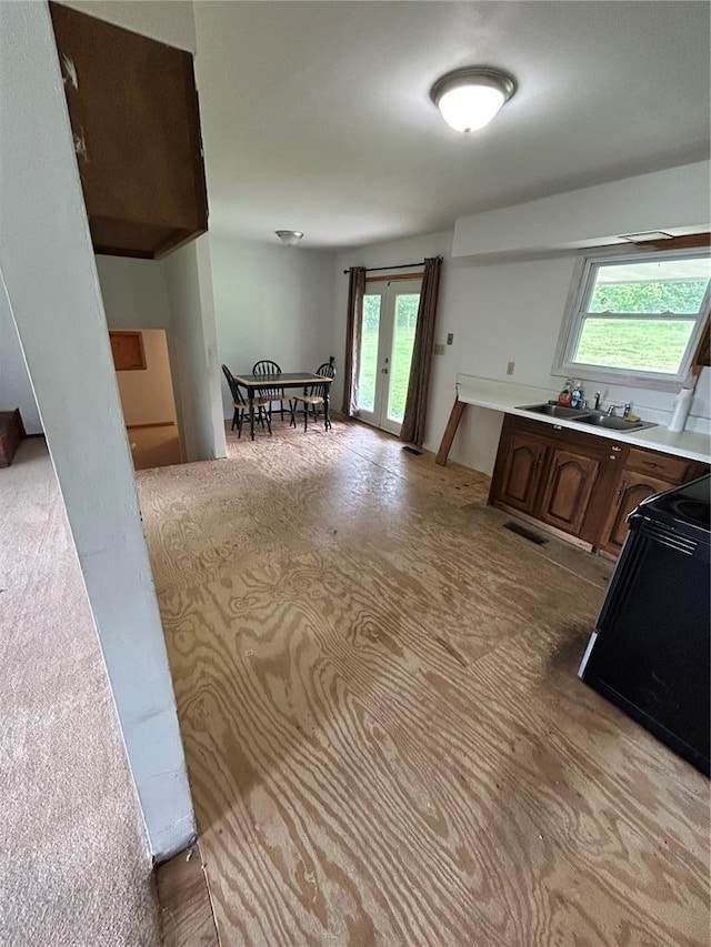 21008 W State Highway 47, Lonedell, MO 63060 - kitchen with stove, a sink, plenty of natural light, and light countertops