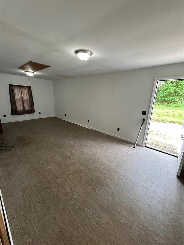 21008 W State Highway 47, Lonedell, MO 63060 - unfurnished living room with dark wood-type flooring and baseboards