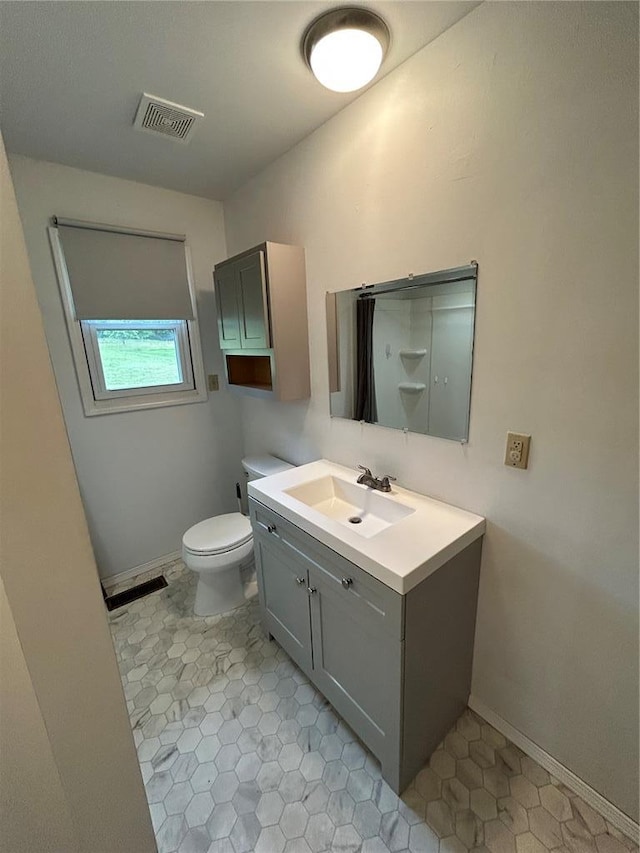 21008 W State Highway 47, Lonedell, MO 63060 - bathroom featuring vanity, toilet, and baseboards