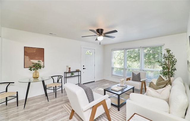 2613 Hillsboro Valley Park Rd, High Ridge, MO 63049 - living area with ceiling fan, light wood-type flooring, and baseboards