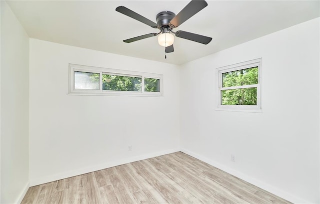 2613 Hillsboro Valley Park Rd, High Ridge, MO 63049 - empty room with plenty of natural light, light wood-style flooring, baseboards, and a ceiling fan
