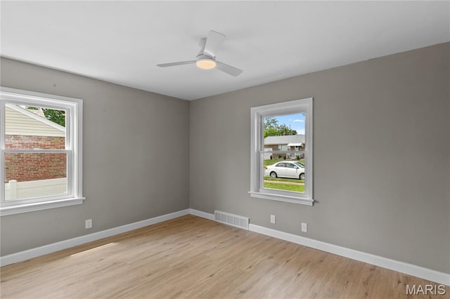 8364 Fullerton Ave, University City, MO 63132 - empty room featuring light wood-type flooring and ceiling fan