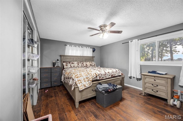 2850 S Hwy W, Winfield, MO 63389 - bedroom with dark wood-style flooring, a textured ceiling, and ceiling fan