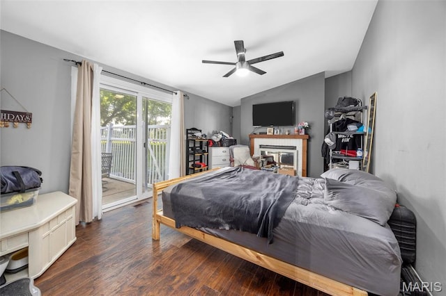 2850 S Hwy W, Winfield, MO 63389 - bedroom featuring access to outside, dark wood-style floors, vaulted ceiling, ceiling fan, and a glass covered fireplace