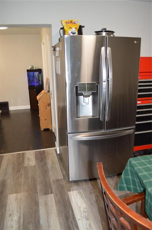 3520 Wismer Rd, Breckenridge Hills, MO 63074 - kitchen with stainless steel refrigerator with ice dispenser, wood finished floors, and baseboards