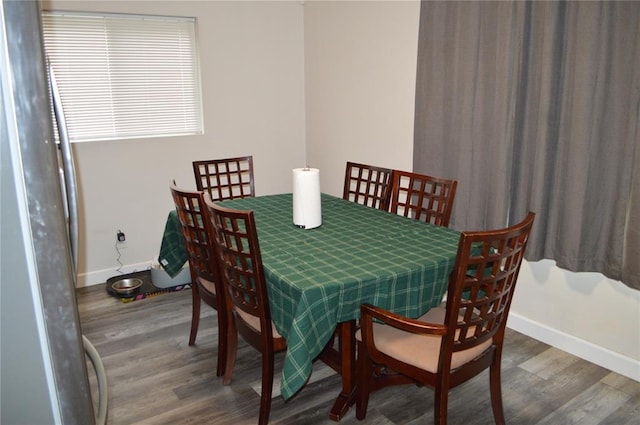 3520 Wismer Rd, Breckenridge Hills, MO 63074 - dining room featuring baseboards and wood finished floors