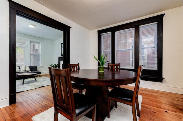4219 Red Bud Ave, Saint Louis, MO 63115 - dining space with light wood-type flooring and baseboards