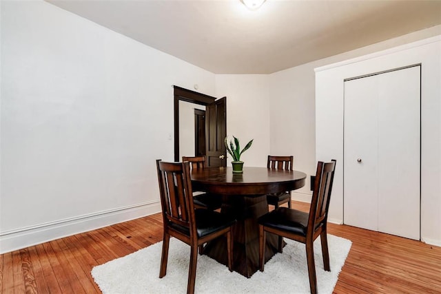 4219 Red Bud Ave, Saint Louis, MO 63115 - dining area featuring light wood finished floors and baseboards