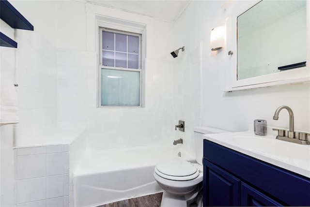 4219 Red Bud Ave, Saint Louis, MO 63115 - bathroom featuring vanity, toilet, bathing tub / shower combination, and wood finished floors