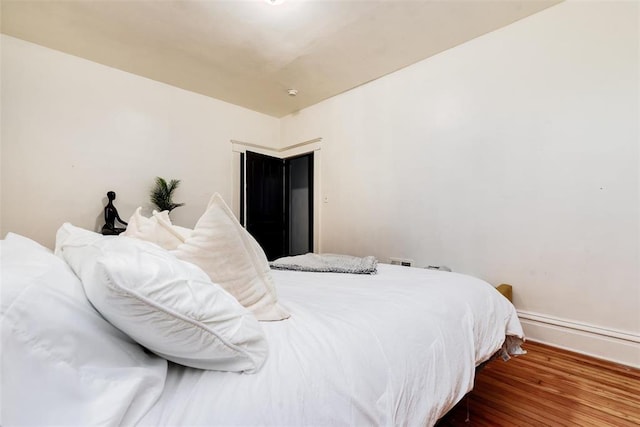 4219 Red Bud Ave, Saint Louis, MO 63115 - bedroom with wood finished floors and baseboards