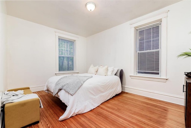 4219 Red Bud Ave, Saint Louis, MO 63115 - bedroom with baseboards and wood finished floors