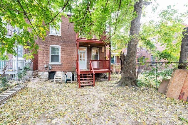 4219 Red Bud Ave, Saint Louis, MO 63115 - back of house featuring brick siding and a balcony