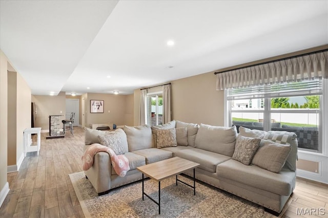 8743 Cardinal Creek Dr, Saint Jacob, IL 62281 - living room featuring light wood-style flooring, baseboards, and recessed lighting