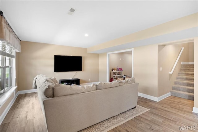 8743 Cardinal Creek Dr, Saint Jacob, IL 62281 - living area featuring light wood finished floors, baseboards, stairway, and recessed lighting