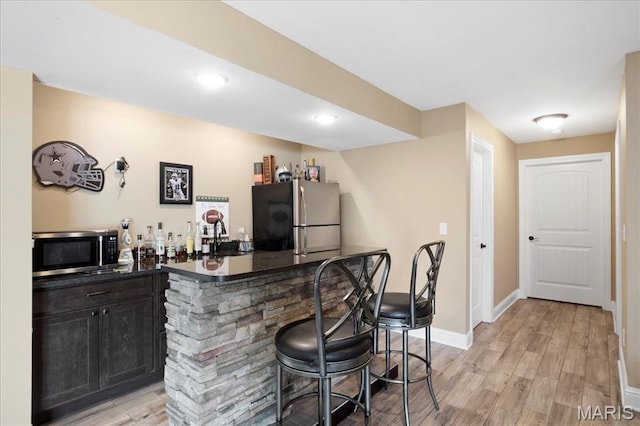 8743 Cardinal Creek Dr, Saint Jacob, IL 62281 - indoor dry bar with stainless steel appliances, light wood-style floors, baseboards, and recessed lighting