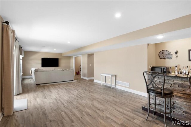 8743 Cardinal Creek Dr, Saint Jacob, IL 62281 - indoor dry bar featuring wood finished floors, baseboards, and recessed lighting