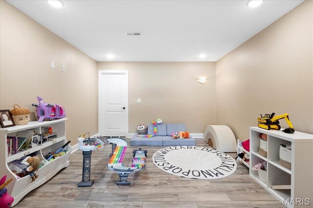 8743 Cardinal Creek Dr, Saint Jacob, IL 62281 - recreation room with recessed lighting, wood finished floors, and baseboards